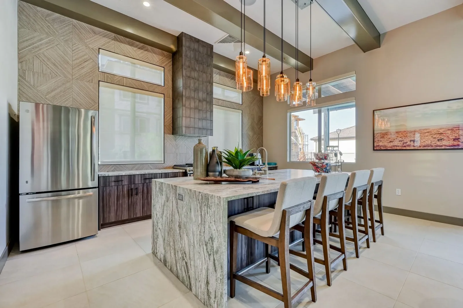 Brookfield clubhouse kitchen and gathering island beneath pendant lighting