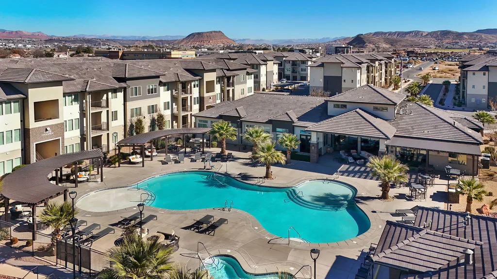 Elevated view of Brookfield’s pool, clubhouse and residences with the St. George landscape beyond