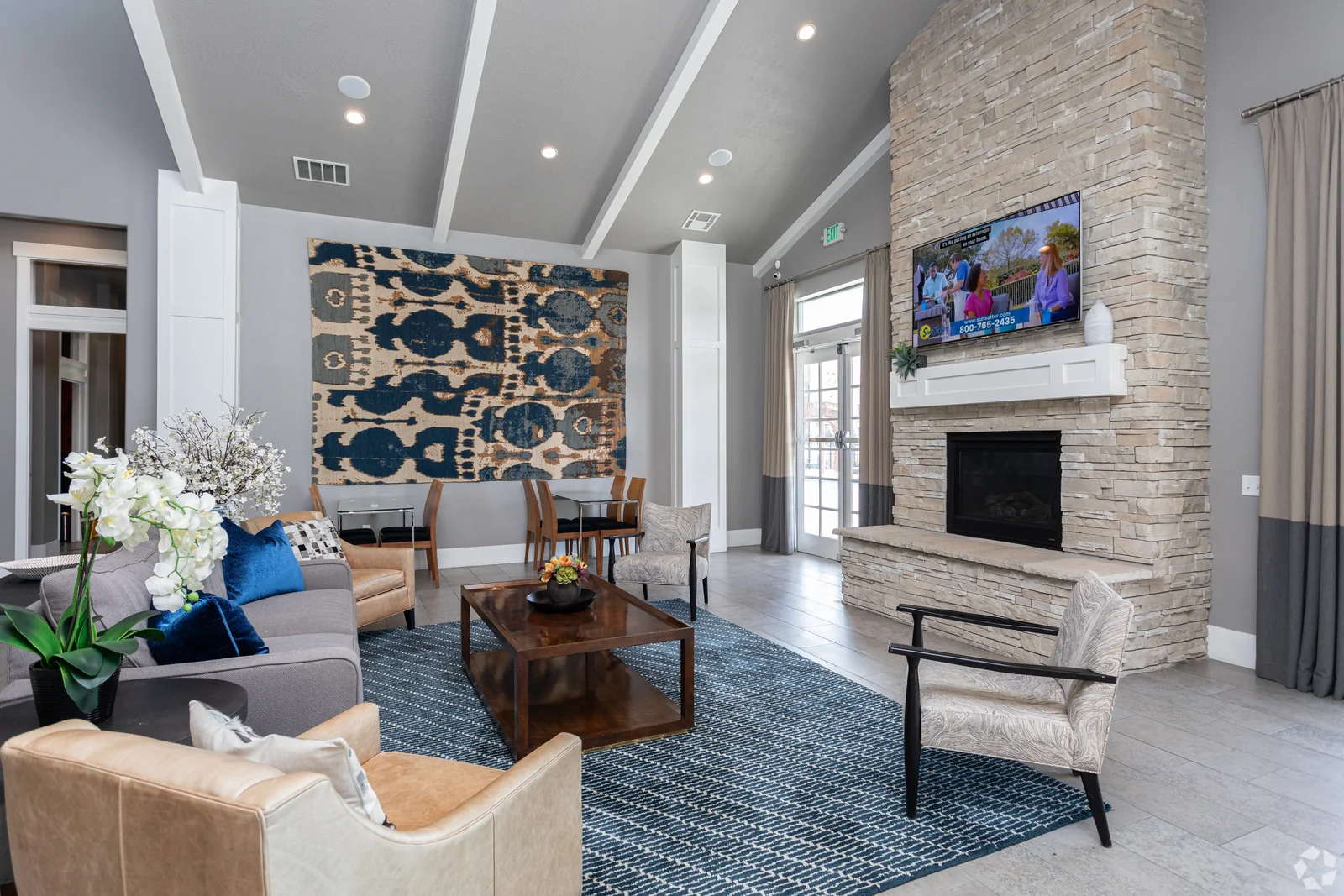 The vaulted clubhouse lounge and stone fireplace at Outlook